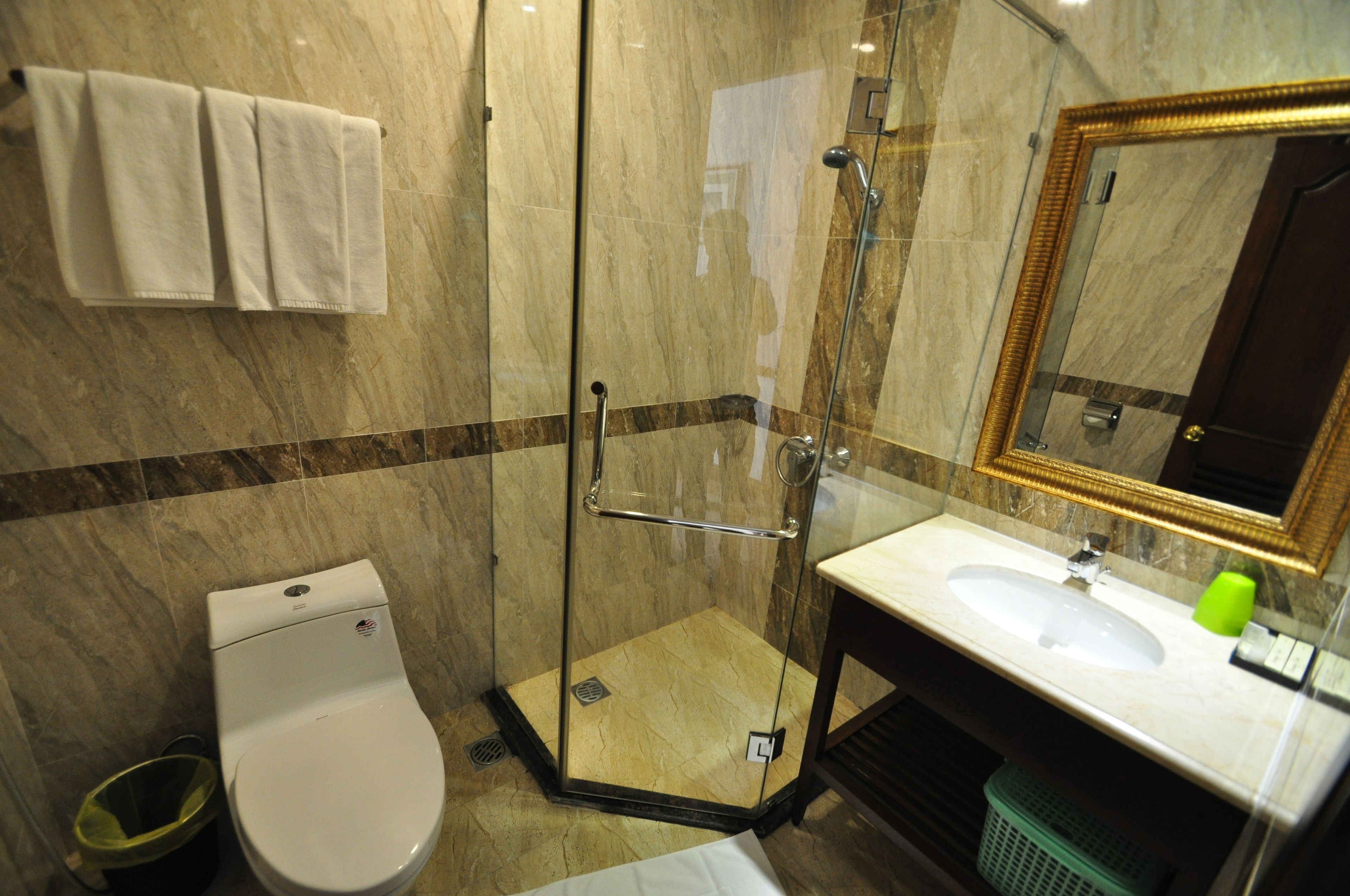 shower, hair dryer, slippers, towels