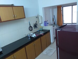 Standard Apartment, 3 Bedrooms, City View | Private kitchen | Fridge, microwave
