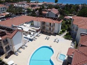 Outdoor pool, open 8 AM to 8 PM, pool umbrellas, pool loungers