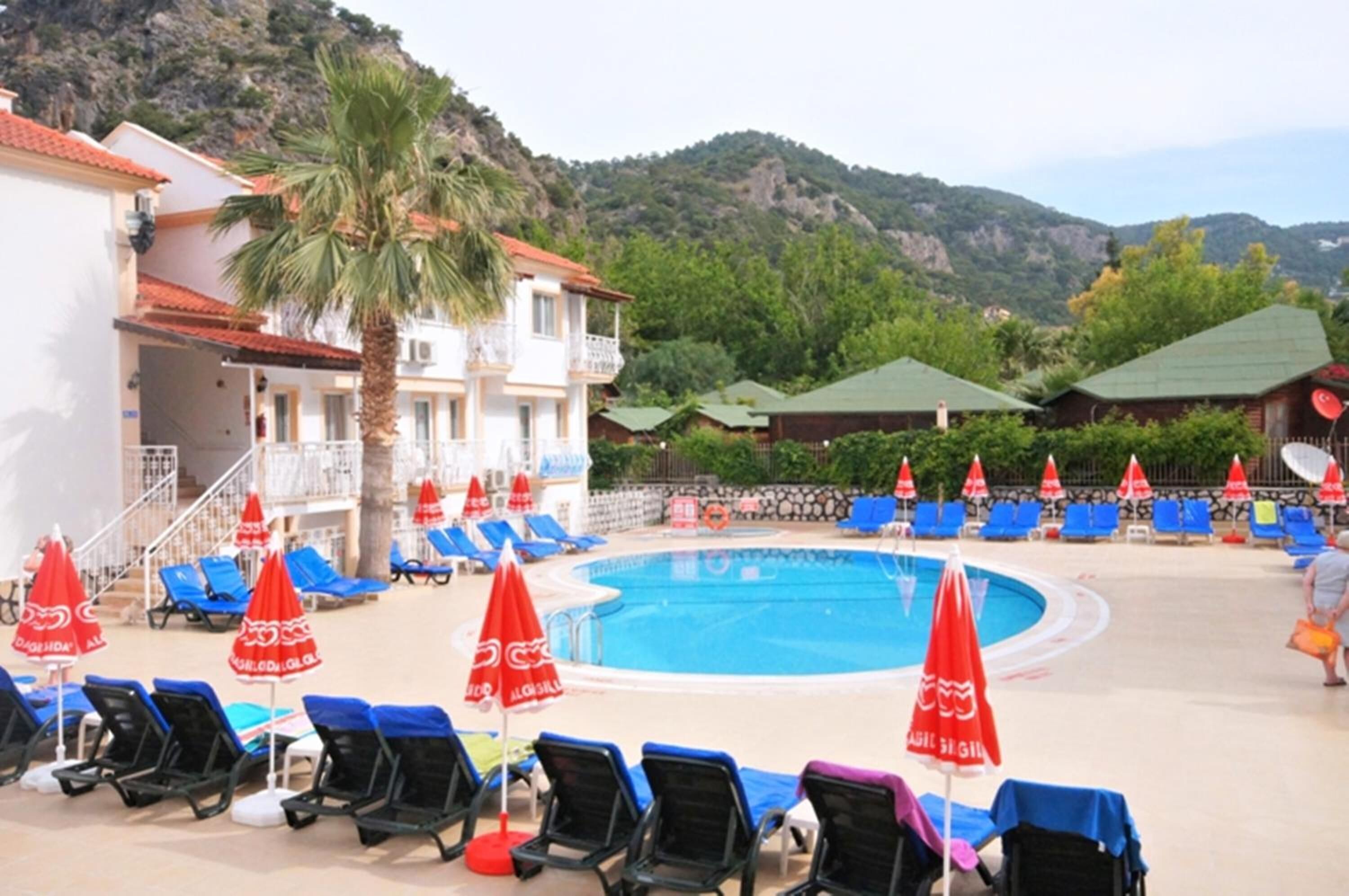 outdoor pool, open 8 am to 8 pm, pool umbrellas, pool loungers
