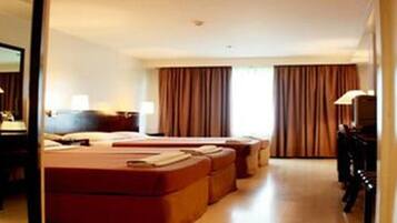 Family Deluxe | Minibar, in-room safe, desk, iron/ironing board (on request)
