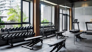 A modern gym with weightlifting equipment, treadmills, and dumbbells. - HYATT - EPISODE Daan Taipei, jdv by Hyatt (Taipei)
