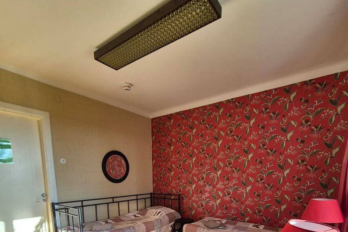 Basic Triple Room, 3 Single Beds, Shared Bathroom, Partial Lake View