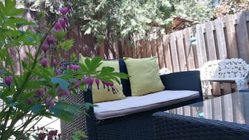 Deluxe Double Room, 1 Queen Bed, Garden View (Private Backyard Access) | 1 bedroom, iron/ironing board, travel crib, free WiFi