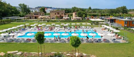 Outdoor pool, open 9:00 AM to 7:00 PM, pool umbrellas, pool loungers