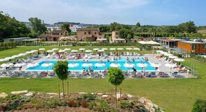 Outdoor pool, open 9:00 AM to 7:00 PM, pool umbrellas, pool loungers