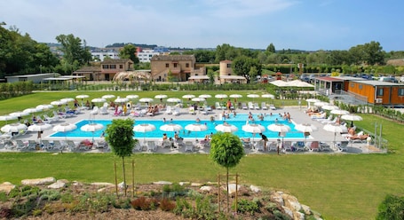 Outdoor pool, open 9:00 AM to 7:00 PM, pool umbrellas, sun loungers