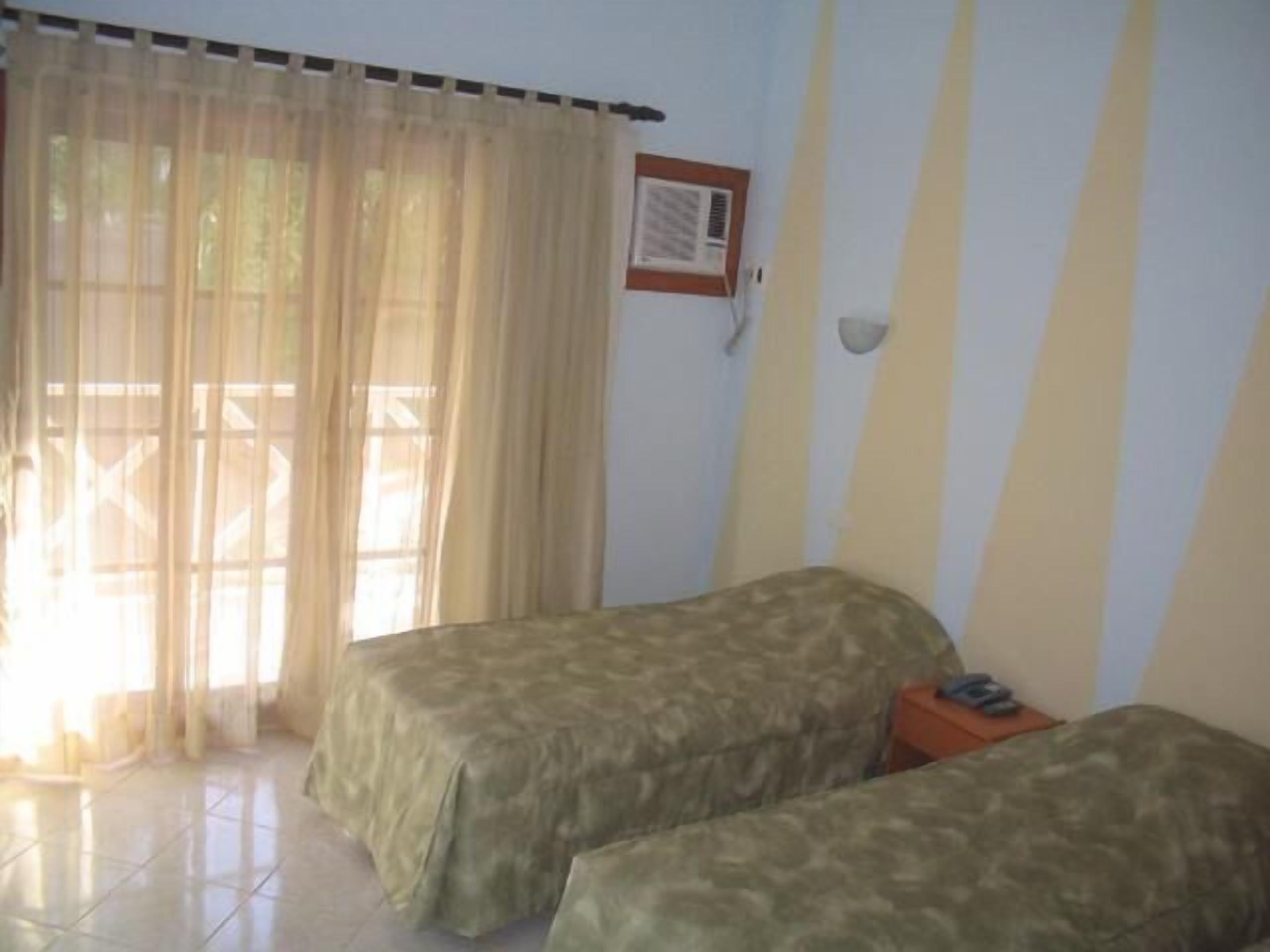 double room, garden view | minibar, blackout curtains, rollaway beds, free wifi