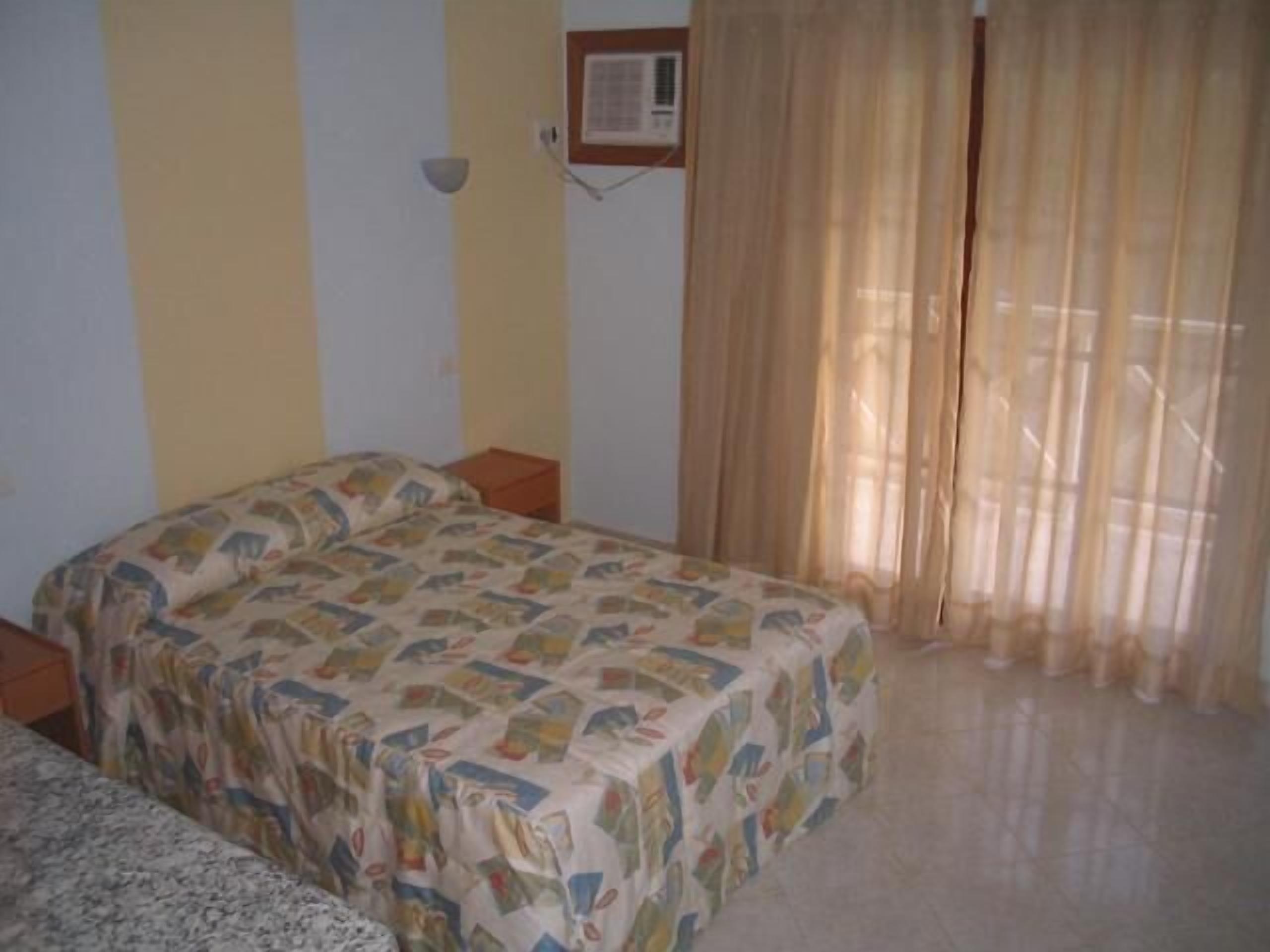 double room, garden view | minibar, blackout curtains, rollaway beds, free wifi