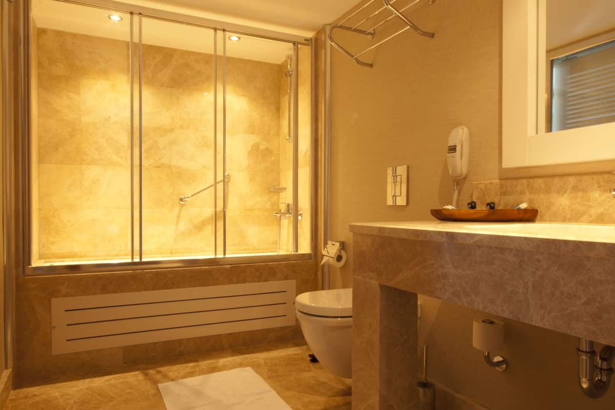 family suite | bathroom | free toiletries, hair dryer, slippers, bidet