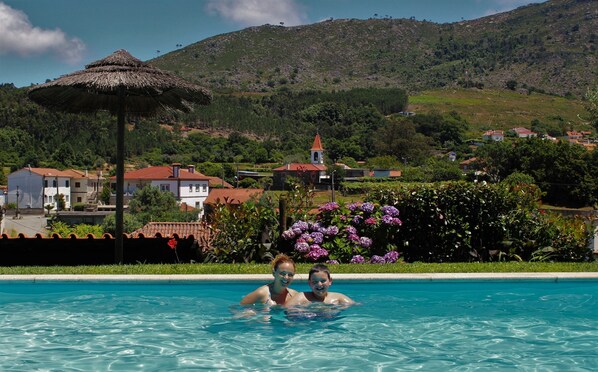 Outdoor pool, pool umbrellas, pool loungers