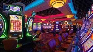 A casino with multiple slot machines and a sign for a 'Casino Hot Rest'.