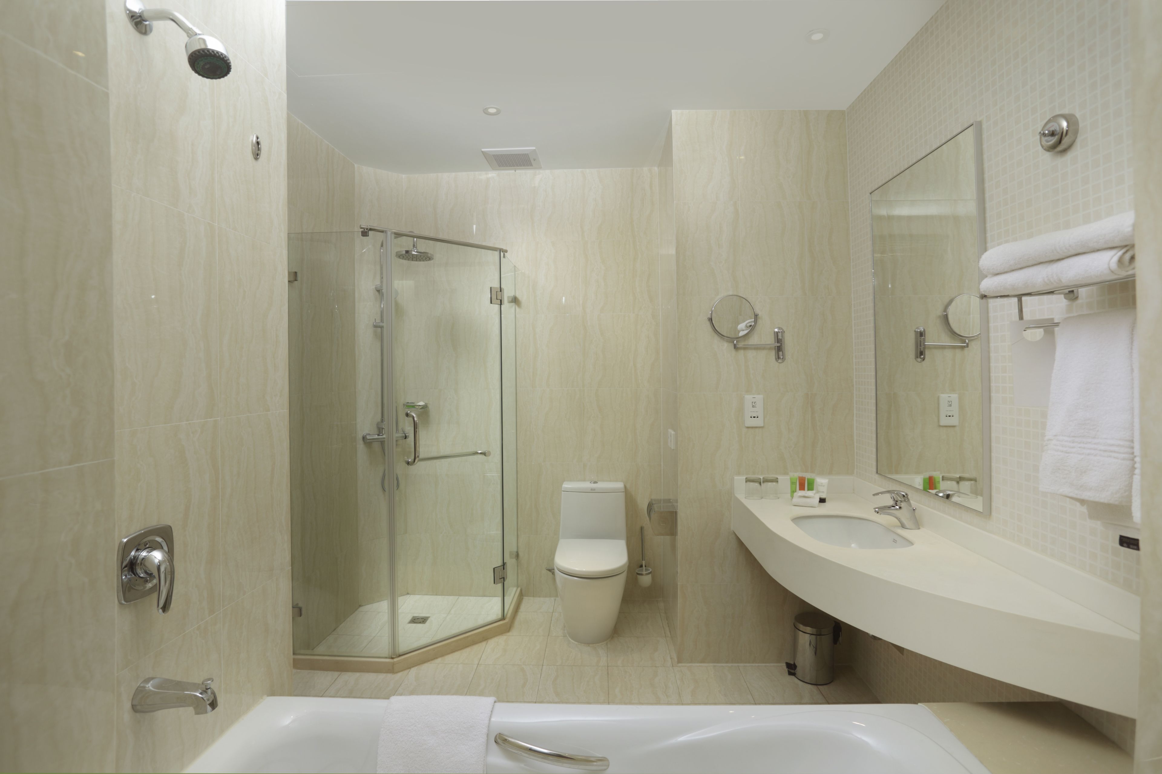 separate bathtub and shower, slippers, towels