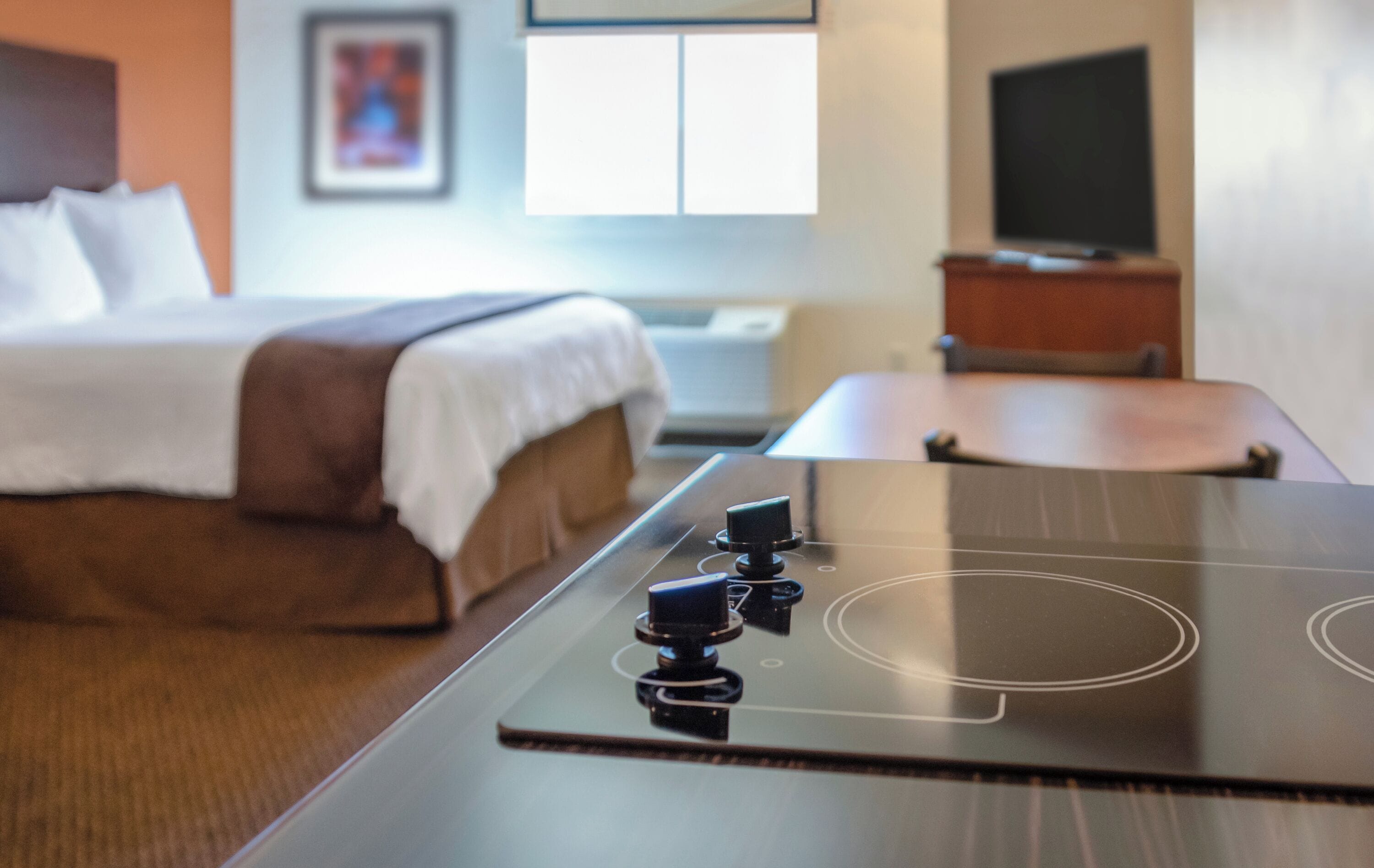 premium bedding, pillow-top beds, desk, laptop workspace