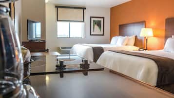Premium bedding, pillow-top beds, desk, laptop workspace
