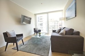 Apartment, 3 Bedrooms | Living area | 32-inch flat-screen TV with cable channels, LCD TV, ping pong - Urbano Apartments Miraflores Pardo (Lima)