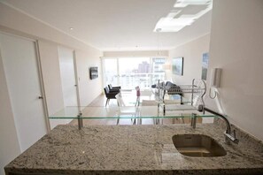 Apartment, 1 Bedroom | Living area | 32-inch flat-screen TV with cable channels, LCD TV, ping pong - Urbano Apartments Miraflores Pardo (Lima)