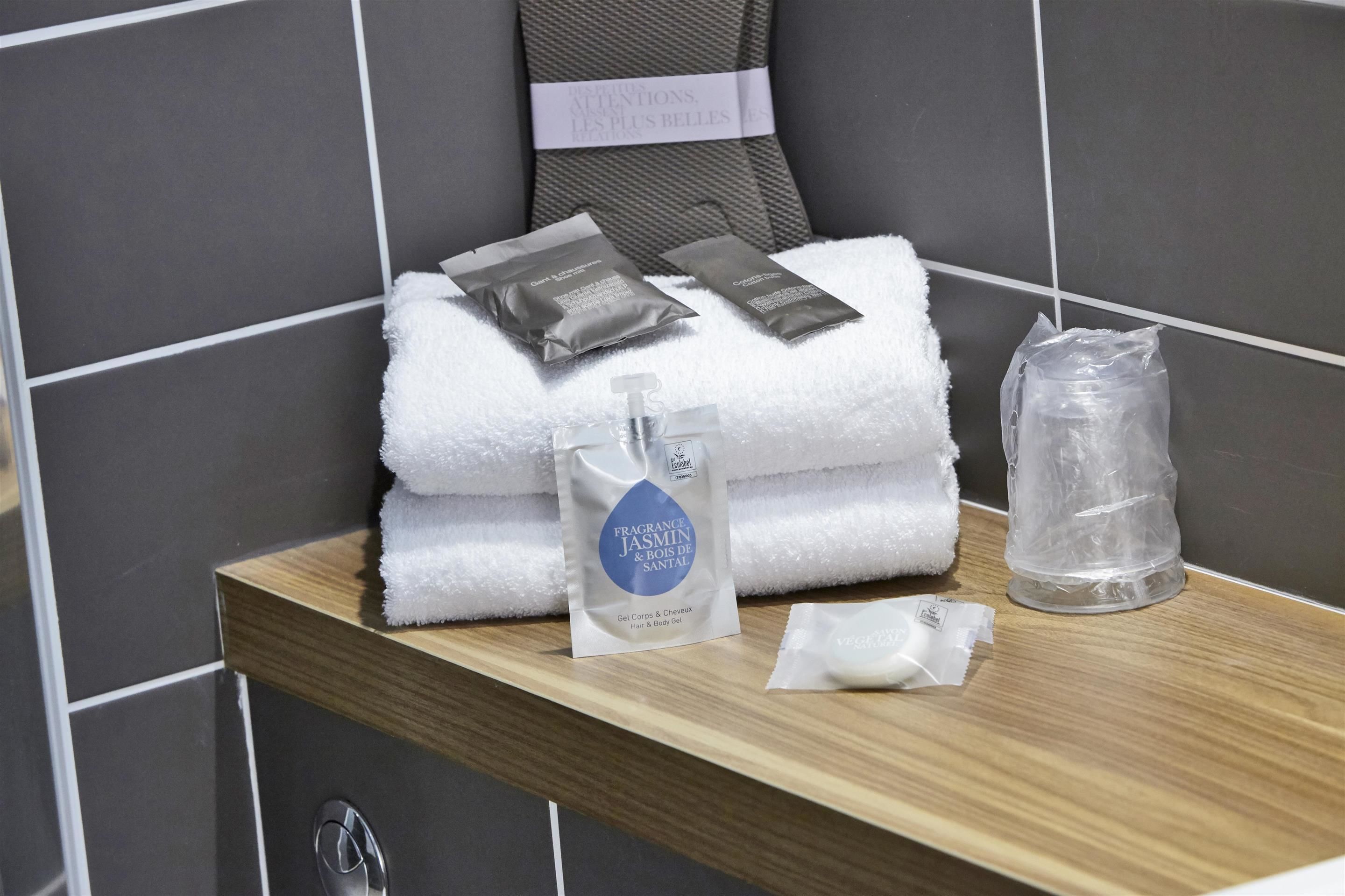 eco-friendly toiletries, hair dryer, towels