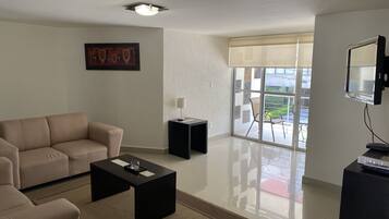 Business Apartment, 2 Bedrooms, 2 Bathrooms | Living area | 32-inch TV with cable channels