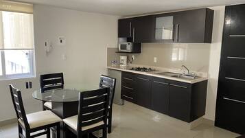 Business Apartment, 2 Bedrooms, 2 Bathrooms | Private kitchen | Fridge, microwave, stovetop, coffee/tea maker
