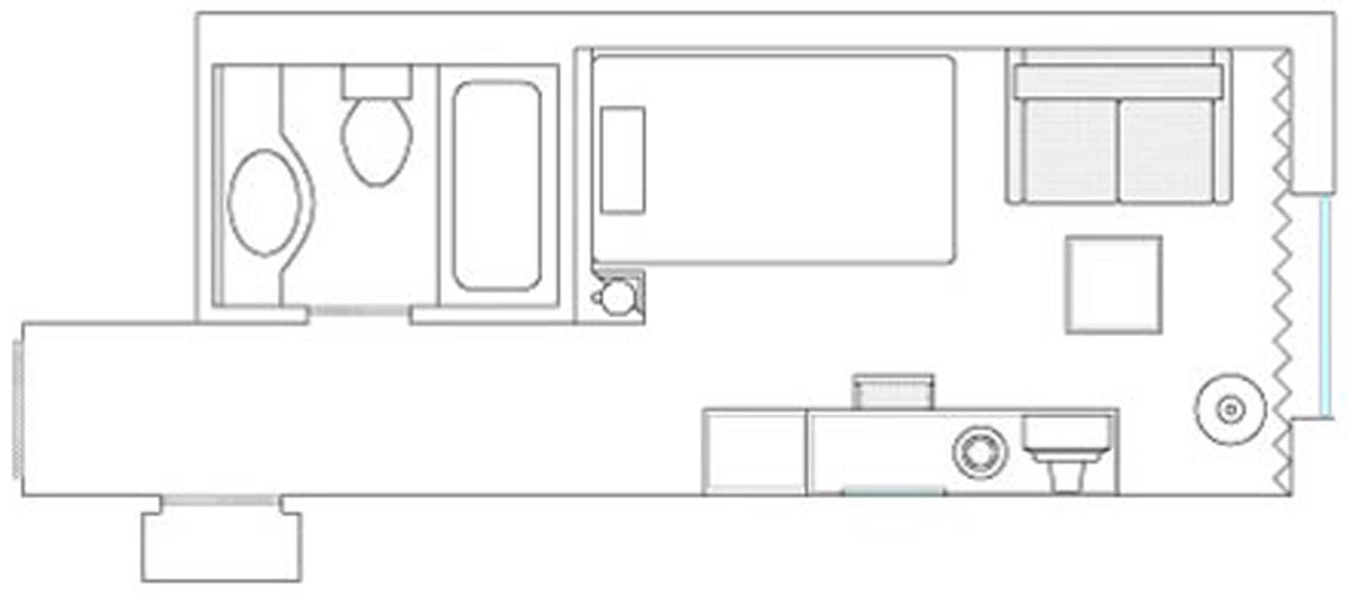 A floor plan with a bathroom, kitchenette, and a seating area.