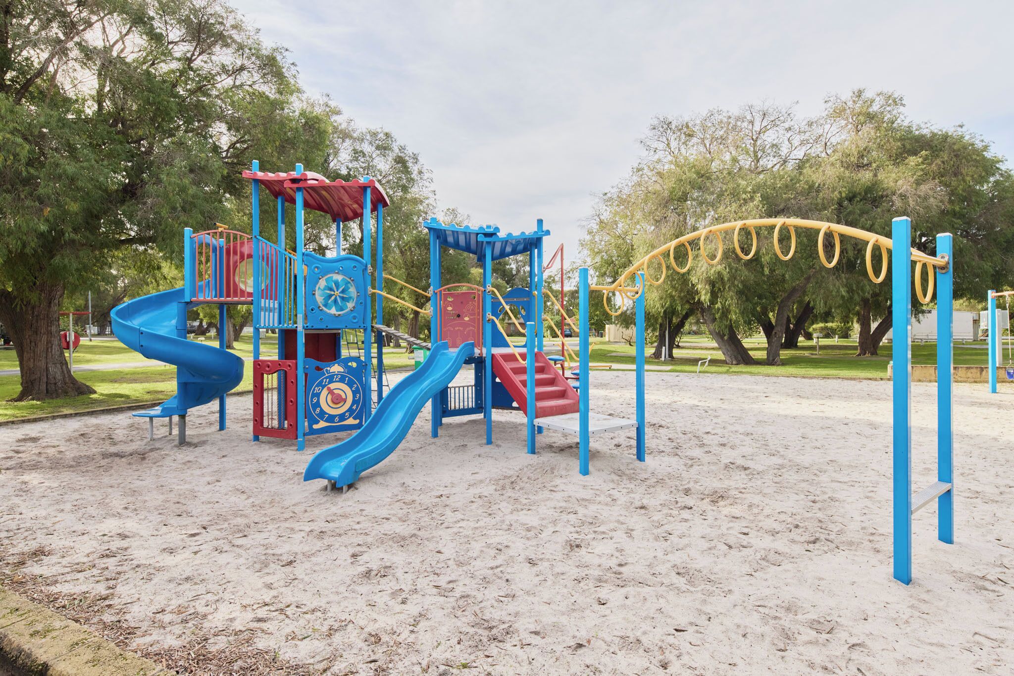 A playground with slides and climbing structures.