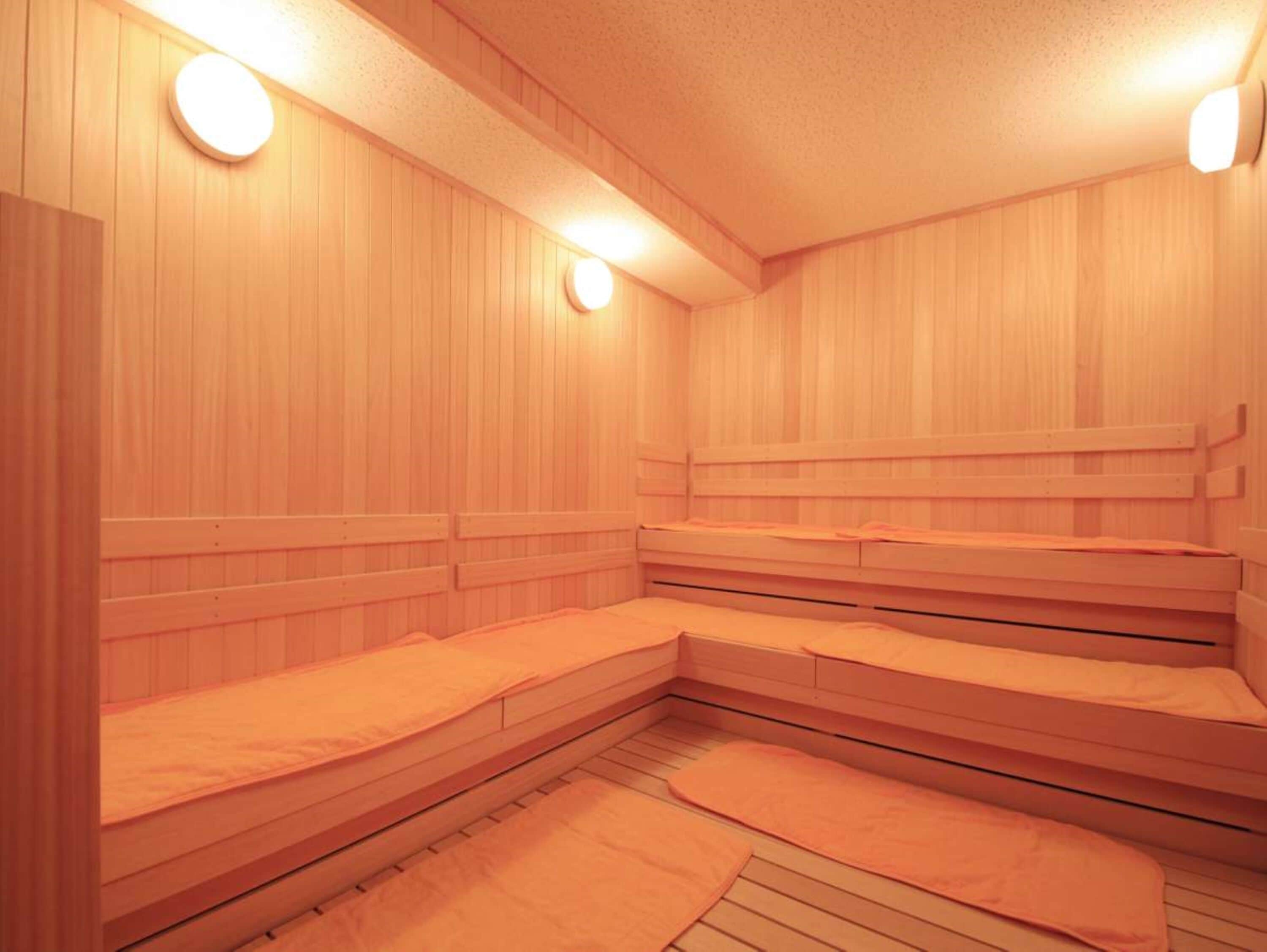 A sauna with wooden walls and benches.