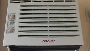 A white air conditioning unit with two dials and a display, labeled 'CONDURA'.