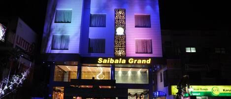 A building with the sign "Saibala Grand" indicating a hotel.
