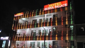 A multi-story building with a sign reading "Hotel Surya Palace." - Hotel Surya Palace (Chandigarh)