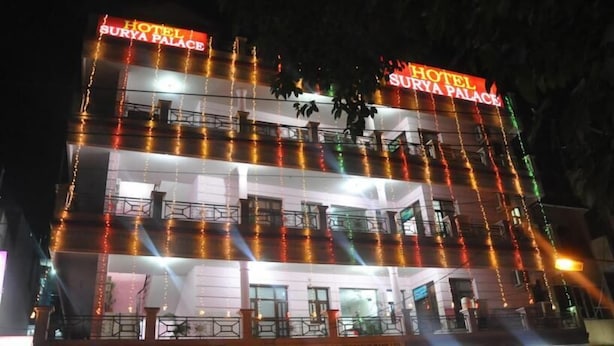 A multi-story building with balconies and a sign reading "Hotel Surya Palace". - Hotel Surya Palace (Chandigarh)