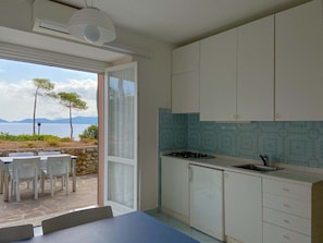 Superior Apartment, Patio, Sea View | Private kitchen | Full-sized fridge, coffee/tea maker, cookware/dishes/utensils - Intur Residence (Marciana Marina)