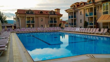 Outdoor pool, pool umbrellas, sun loungers