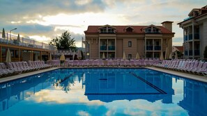 Outdoor pool, pool umbrellas, pool loungers