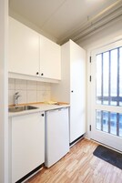 Tabla de planchar con plancha, wifi gratis y ropa de cama 