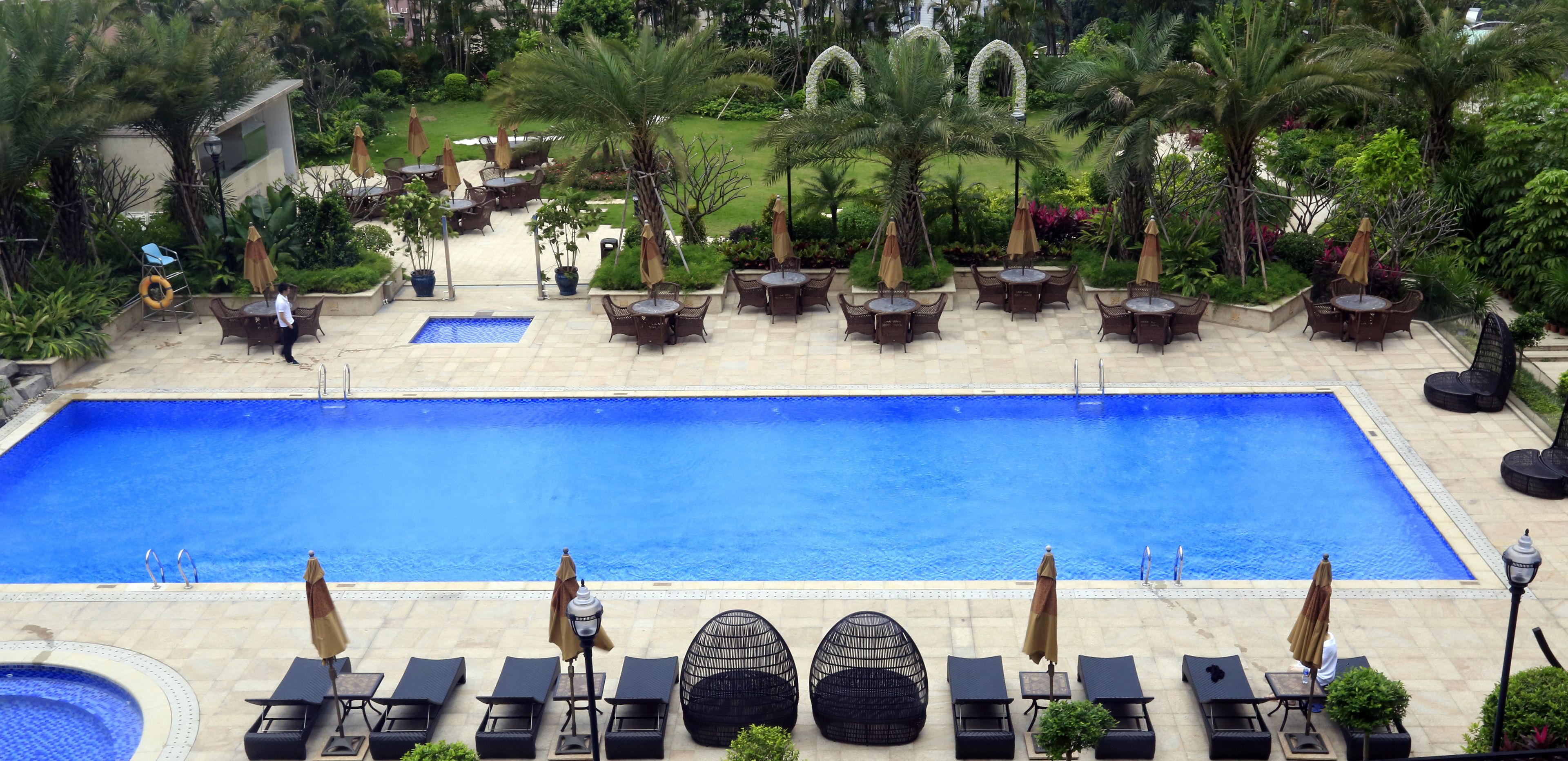 2 outdoor pools, open 7:00 am to 11:00 pm, pool umbrellas, pool loungers