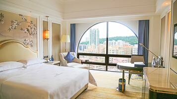 Premium bedding, down comforters, pillowtop beds, minibar