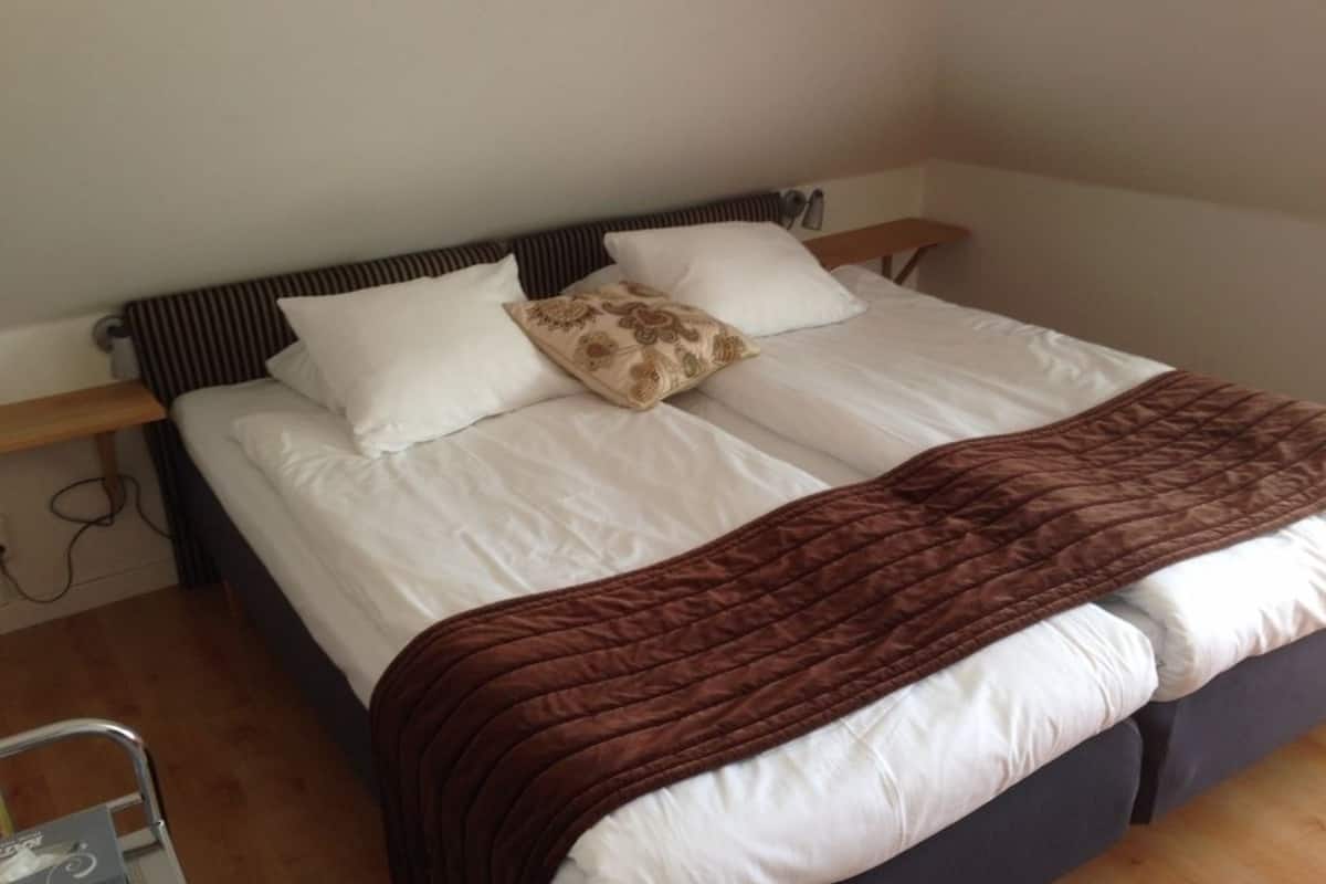 economy twin room, shared bathroom | premium bedding, blackout curtains, iron/ironing board, travel cot