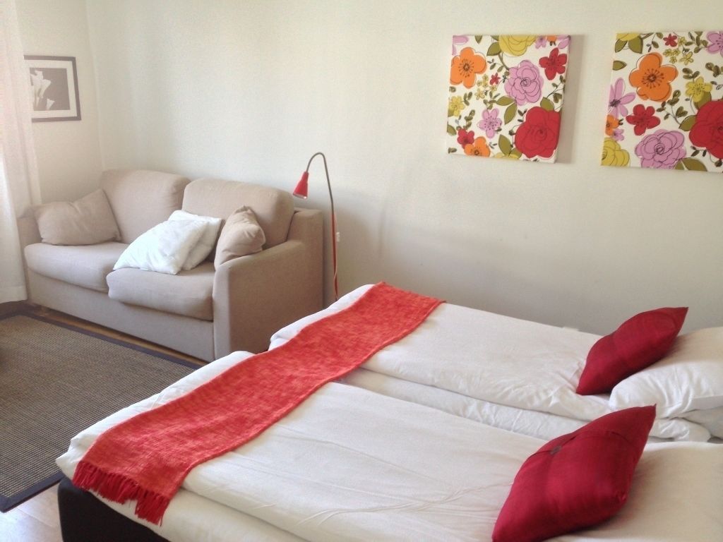 family room | premium bedding, blackout curtains, iron/ironing board, travel cot