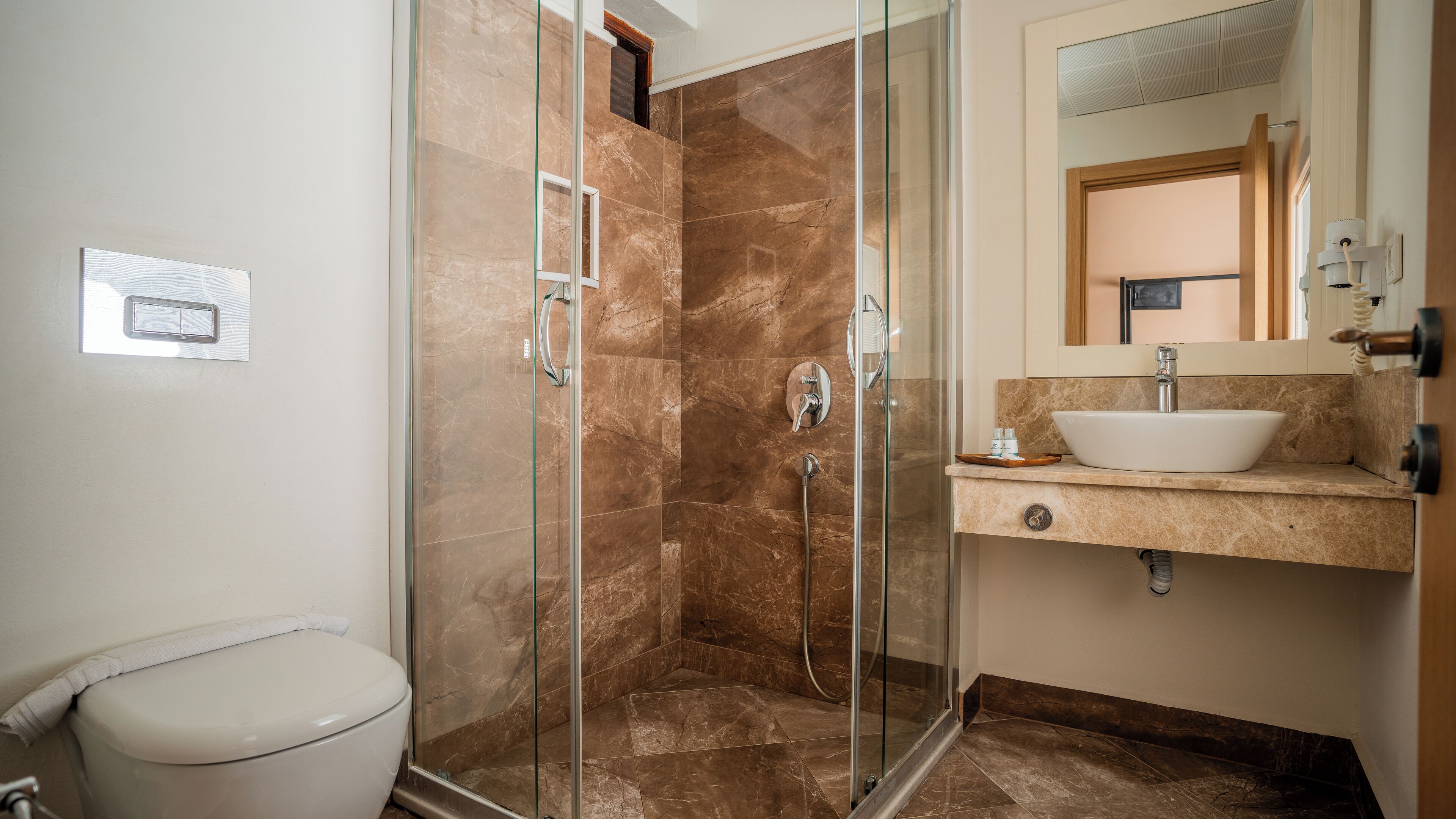 deluxe room | bathroom | shower, free toiletries, hair dryer, slippers