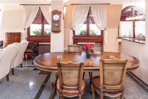 Family Suite, 1 Bedroom, Balcony, Mountain View | In-room dining