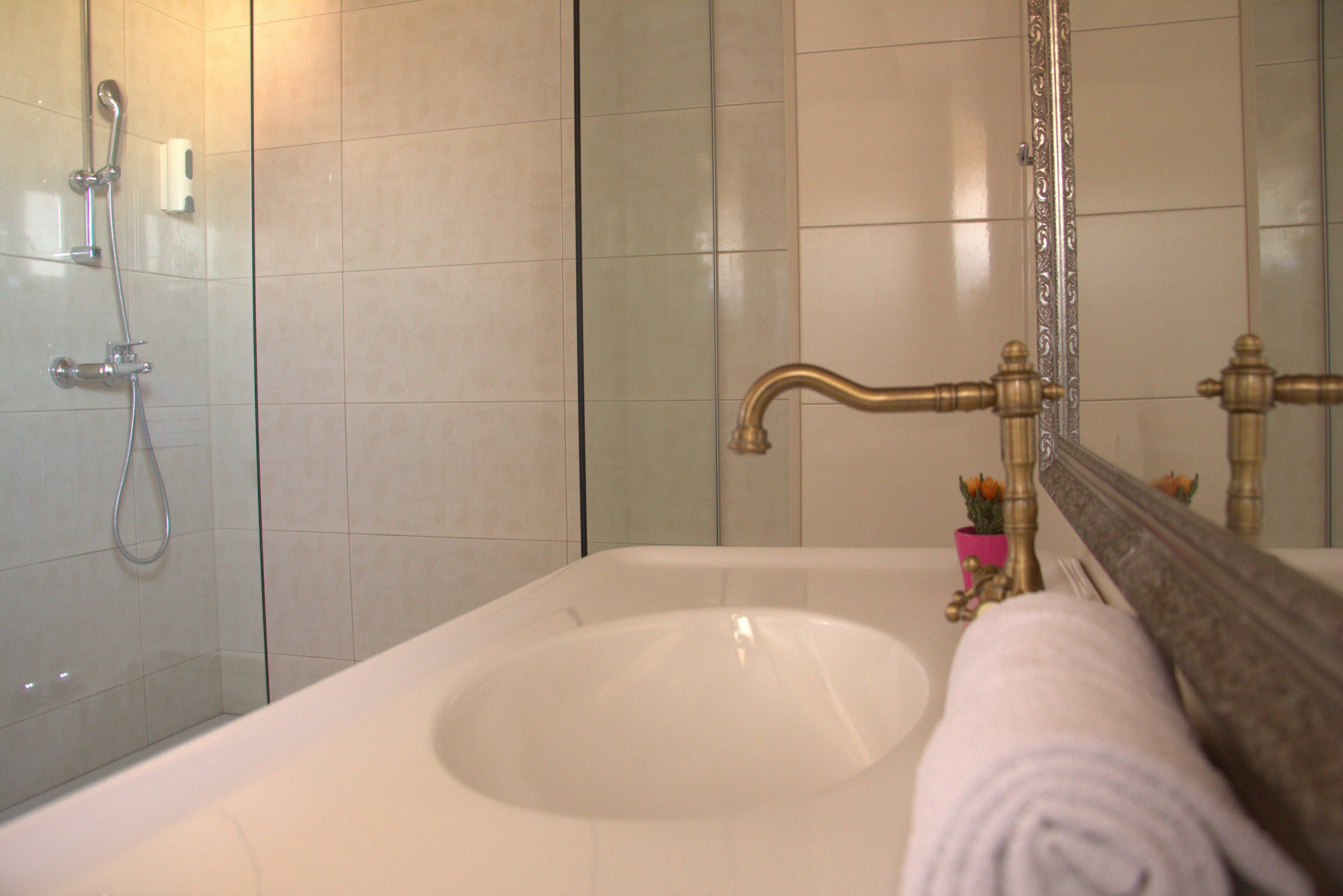 family room, city view | bathroom | shower, free toiletries, hair dryer, towels