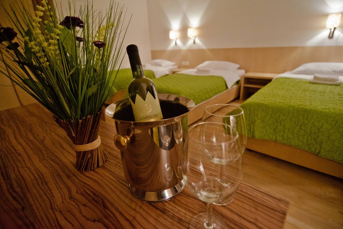 family room, city view | premium bedding, free cots/infant beds, free wifi, wheelchair access