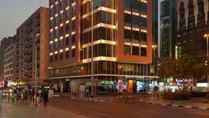 A modern Hyatt Place hotel with a prominent glass facade, multiple floors, and a well-lit entrance area.