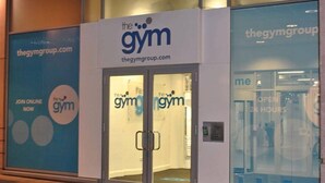 A gym with glass doors and a sign reading "the gym". - Dreamhouse Apartments London (London)