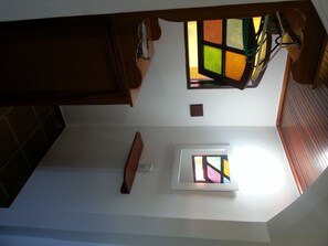 A staircase with a small window at the top.