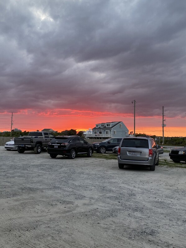 A parking lot with several SUVs and a pickup truck. - Seaview Pier and Motel (Sneads Ferry)