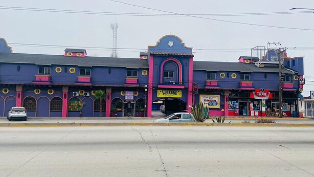 A multi-story building with a mix of commercial and residential spaces. - Hotel Baja del Sol Inn (Playas de Rosarito)