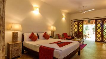 Deluxe Room, Garden View | Living area | 32-inch Smart TV with digital channels, TV, streaming services