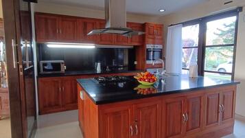 Four Bedroom Private Pool Villa | Private kitchen | Full-sized fridge, microwave, oven, stovetop
